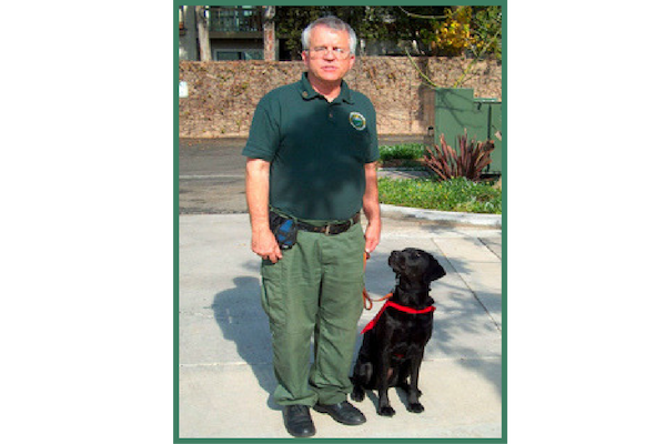 Handler Mike Cochrane and Detector Dog CeCe