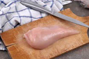 raw chicken on cutting board