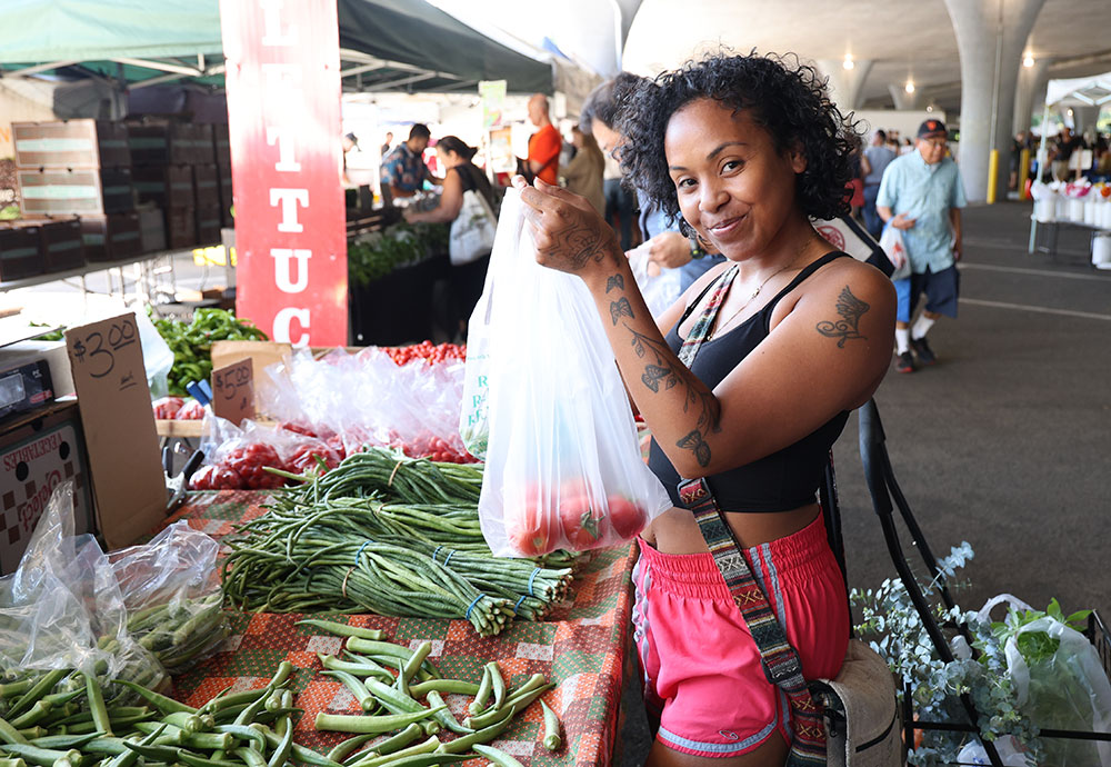 photo: woman shopping in a farmers market