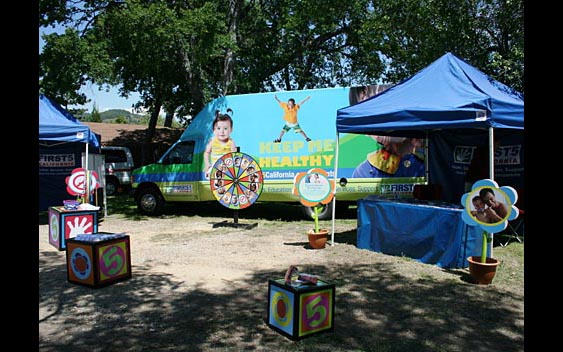Fairs provide an important venue for organizations to perform community outreach. This information booth for the First5 program is ensuring that the youngest Californians stay healthy. Calaveras County Fair, Angels Camp