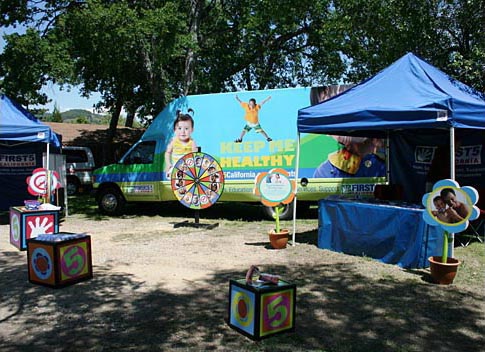 Fairs provide an important venue for organizations to perform community outreach. This information booth for the First5 program is ensuring that the youngest Californians stay healthy. Calaveras County Fair, Angels Camp