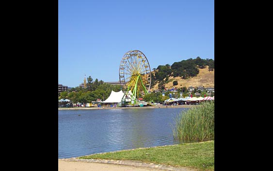 A ferris wheel near a lake