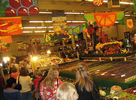 Fairgoers enjoy a colorful display of the county's bountiful harvest. Big Fresno Fair, Fresno
