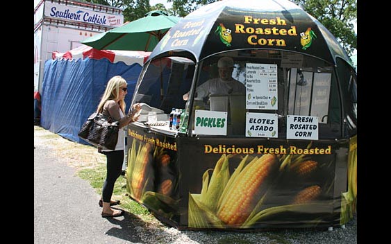 A fairgoer about to enjoy some delicious corn on the cob. Calaveras County Fair, Angels Camp