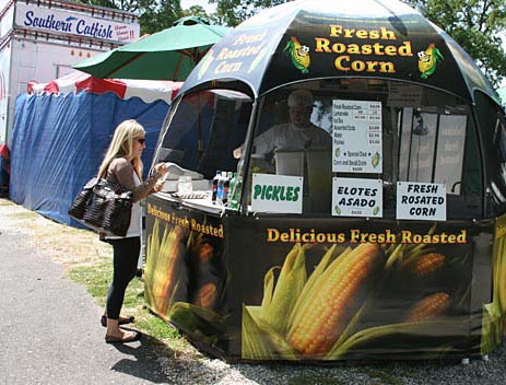 A fairgoer about to enjoy some delicious corn on the cob. Calaveras County Fair, Angels Camp
