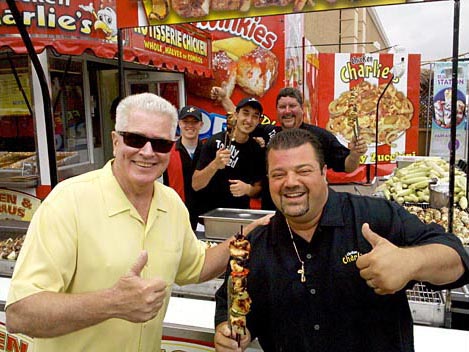 Huell Howser and "Chicken" Charlie Boghosian enjoy some delicious fair food. San Diego County Fair, Del Mar
