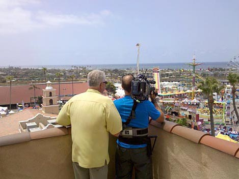 Huell Howser and fairgoer enjoy a sweet treat. Marin County Fair & Exposition, San Rafael