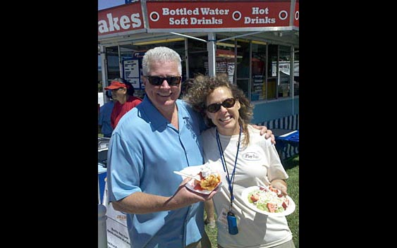 Huell Howser and fairgoer enjoy a sweet treat. Marin County Fair & Exposition, San Rafael