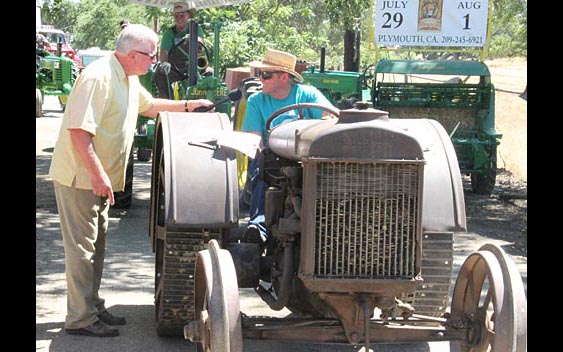 Huell Howser learns about tractors. Amador County Fair, Plymouth