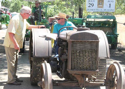 Huell Howser learns about tractors. Amador County Fair, Plymouth