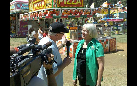Huell Howser interviewing fair CEO Sandy Woods. Nevada County Fair, Grass Valley