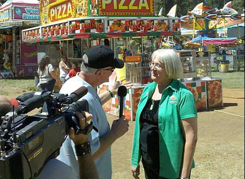 Huell Howser interviewing fair CEO Sandy Woods. Nevada County Fair, Grass Valley