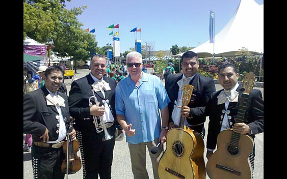 Huell Howser enjoys the tunes of a Mariachi band. Marin County Fair & Exposition, San Rafael