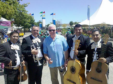 Huell Howser enjoys the tunes of a Mariachi band. Marin County Fair & Exposition, San Rafael
