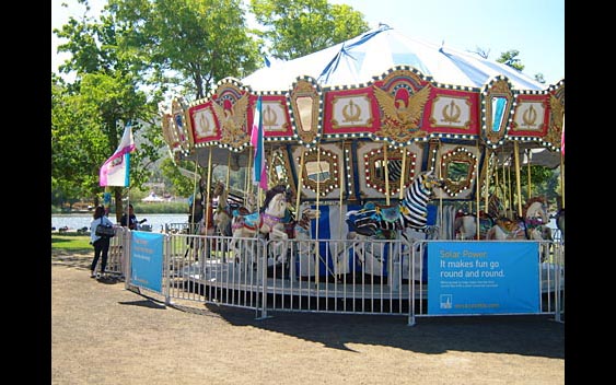Fairgoers take a spin on a solar powered carousel. Marin County Fair & Exposition, San Rafael