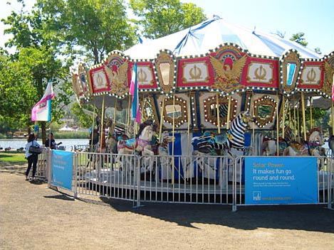 Fairgoers take a spin on a solar powered carousel. Marin County Fair & Exposition, San Rafael