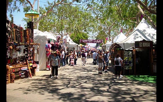 A shady, tree-lined shopping area. Orange County Fair, Costa Mesa