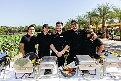 A group of caterers prepare a buffet