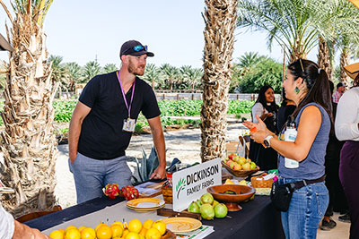 A vendor talks with an attendee