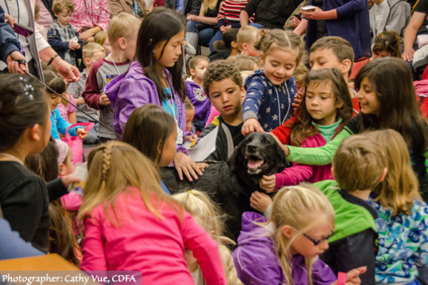 Detection Dog Bart surrounded by his young fans. (Photographer: Cathy Vue, CDFA)