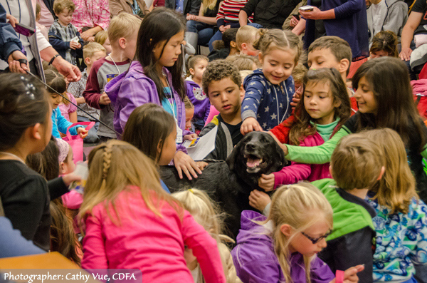 Detection Dog Bart surrounded by his young fans. (Photographer: Cathy Vue, CDFA)